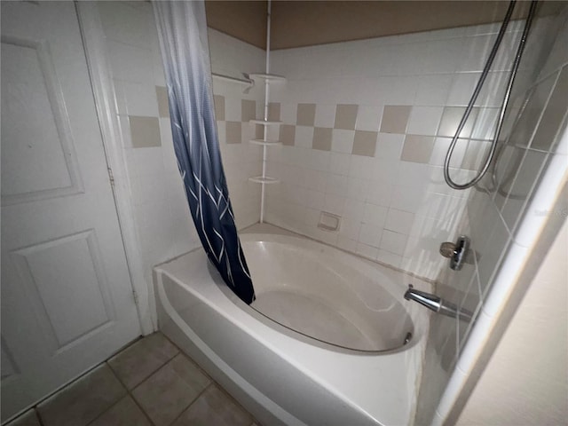 full bath featuring shower / bath combo and tile patterned floors