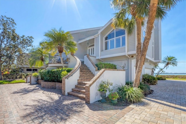 view of front of house with stairway