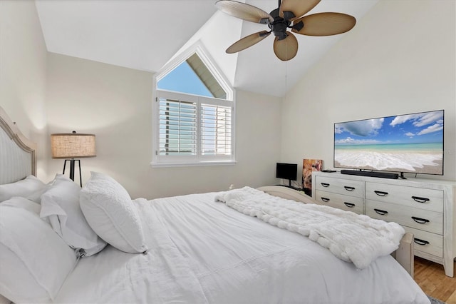 bedroom with lofted ceiling, light wood-style flooring, and ceiling fan