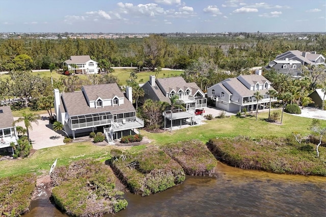 bird's eye view with a residential view and a wooded view