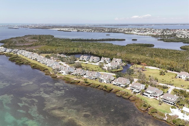 drone / aerial view with a water view and a residential view