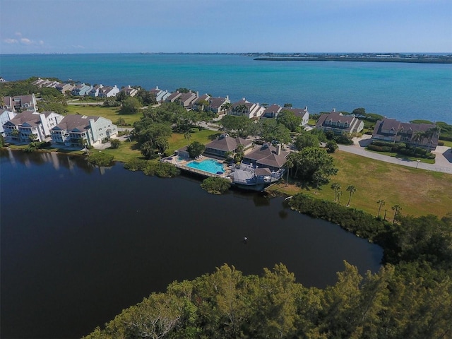 drone / aerial view featuring a residential view and a water view