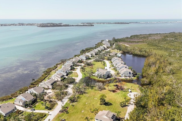 drone / aerial view with a water view and a residential view