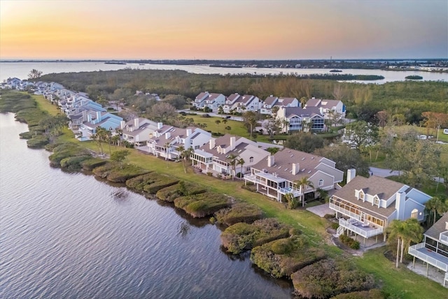 birds eye view of property with a residential view and a water view