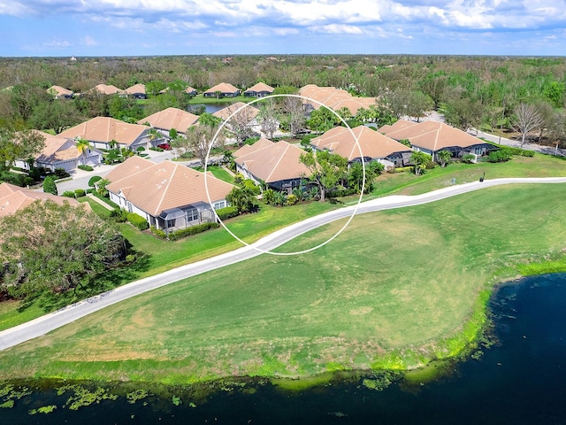 birds eye view of property with a residential view and a water view