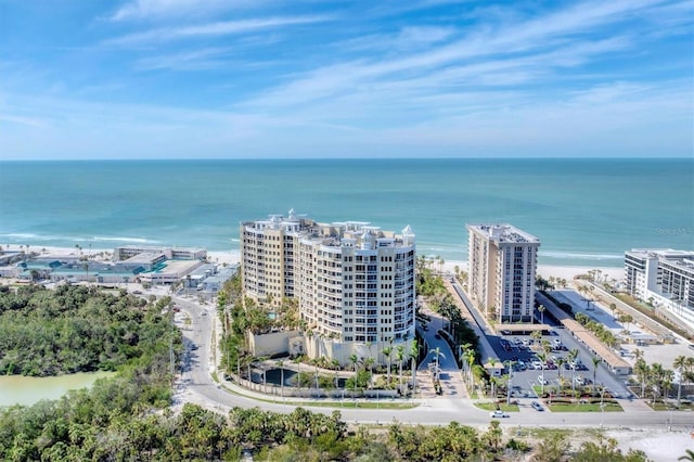 birds eye view of property featuring a water view and a city view