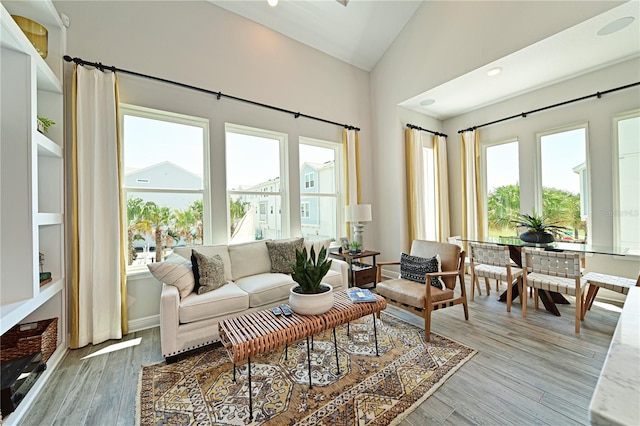 sunroom featuring lofted ceiling