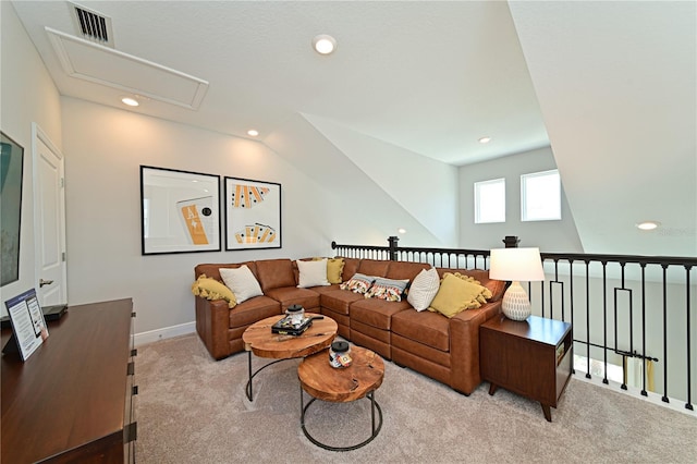 carpeted living area with attic access, visible vents, baseboards, and recessed lighting