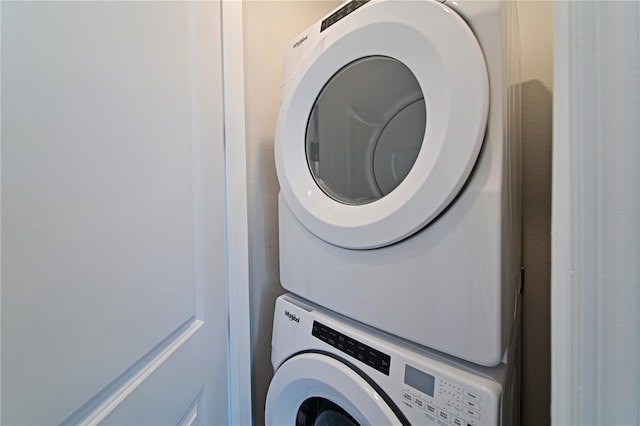 laundry room featuring laundry area and stacked washer and clothes dryer