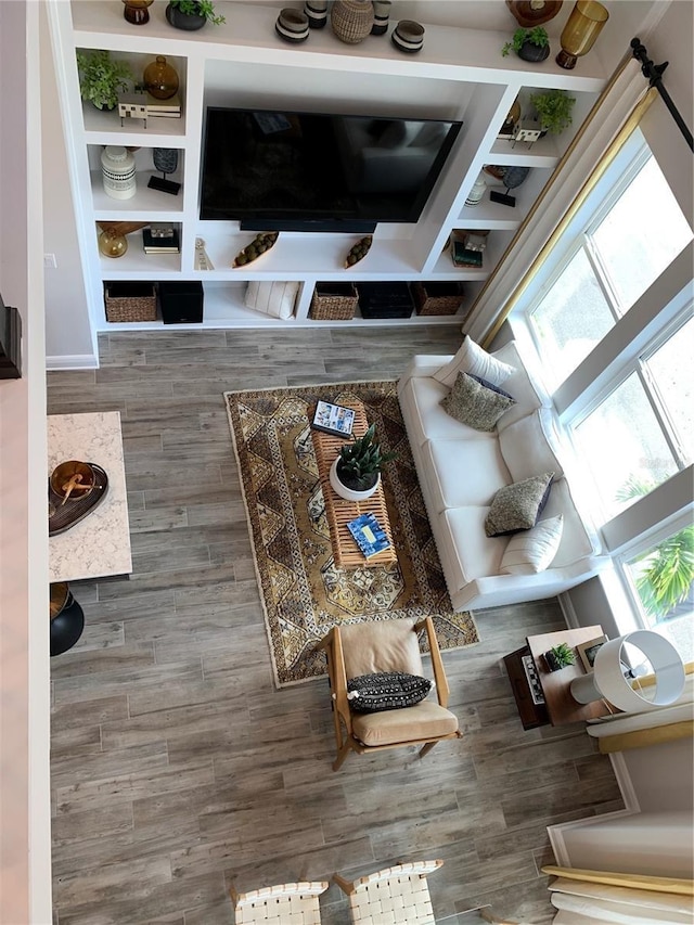 unfurnished living room featuring wood finished floors