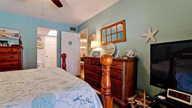 bedroom featuring visible vents and a ceiling fan