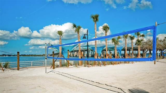 view of property's community featuring a water view and volleyball court