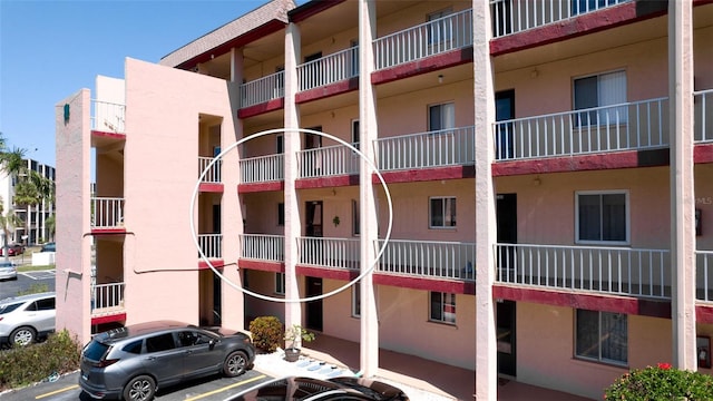 4133 Heron Way Unit E202, Bradenton, FL 34205 - view of apartment building / complex featuring uncovered parking