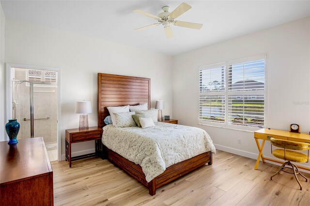 bedroom featuring ceiling fan, light wood finished floors, and baseboards