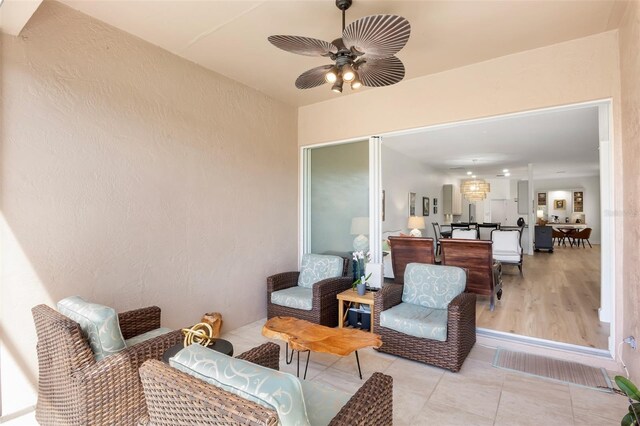 view of patio featuring ceiling fan