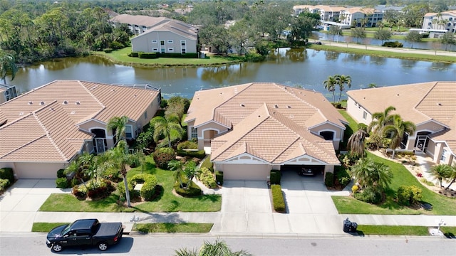 aerial view with a water view and a residential view