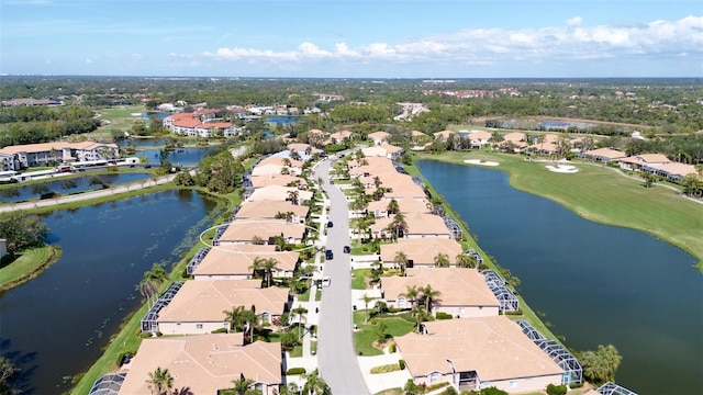 bird's eye view featuring a residential view and a water view