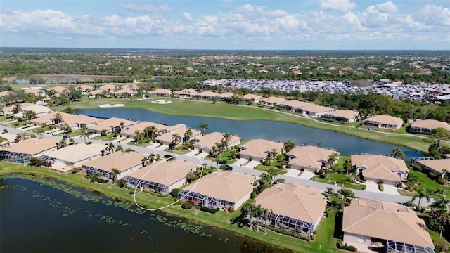 aerial view featuring a residential view, a water view, and golf course view