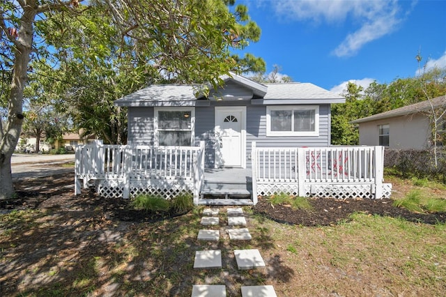 bungalow-style house with a deck