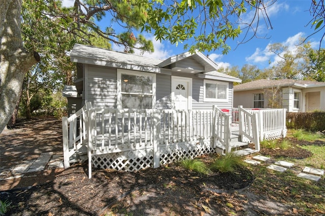 view of front of property featuring a wooden deck