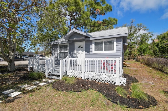 view of front of home with roof with shingles