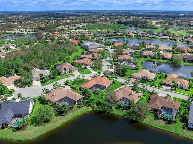 birds eye view of property with a residential view and a water view