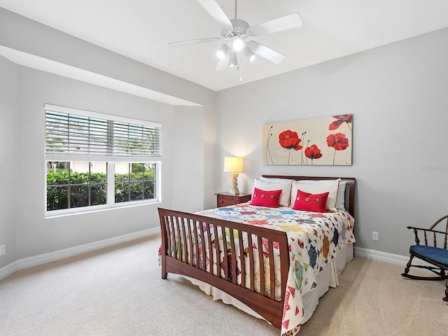 bedroom with carpet floors, baseboards, and a ceiling fan