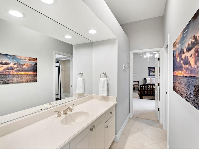 bathroom featuring tile patterned flooring, recessed lighting, a ceiling fan, baseboards, and vanity