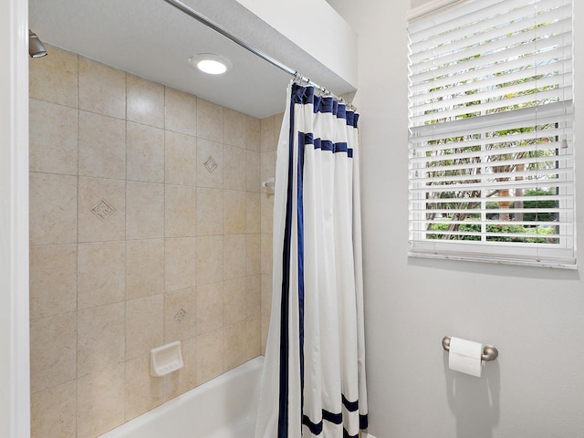 full bath featuring shower / bathtub combination with curtain