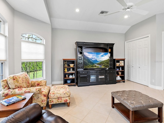 living area with vaulted ceiling, light tile patterned floors, and recessed lighting