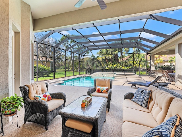 pool featuring ceiling fan, glass enclosure, a patio area, and an outdoor living space