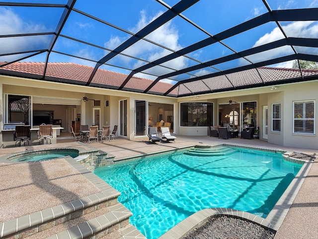 view of pool with ceiling fan, outdoor lounge area, a pool with connected hot tub, outdoor dining space, and a patio area