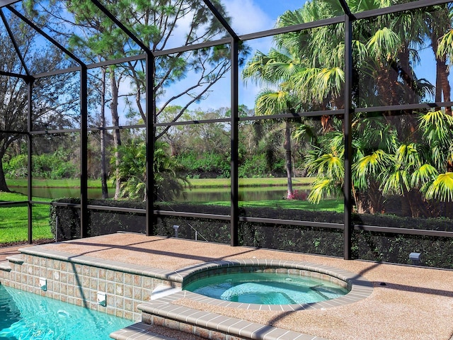 view of swimming pool with glass enclosure, a water view, and an in ground hot tub