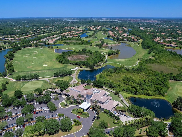 aerial view featuring golf course view and a water view