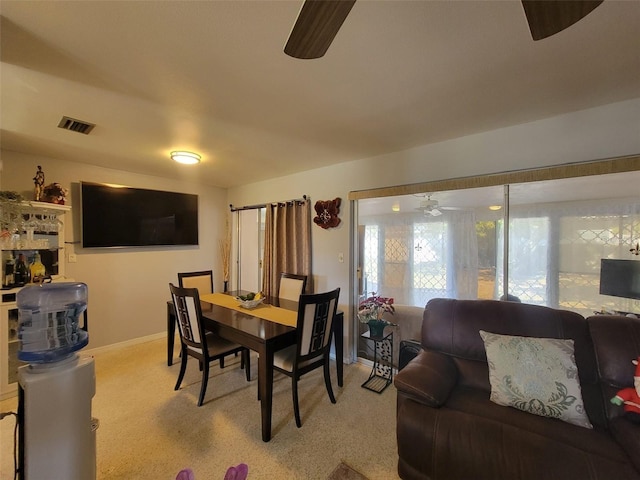 dining area with visible vents, baseboards, and ceiling fan