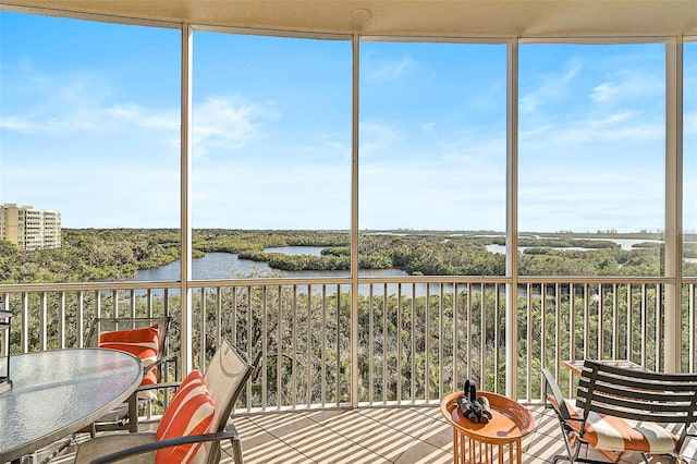 sunroom with a water view