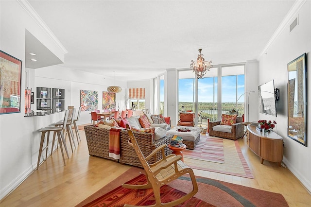 sunroom featuring visible vents and an inviting chandelier