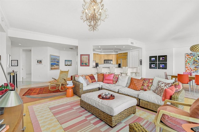 living room featuring ornamental molding, a notable chandelier, and recessed lighting