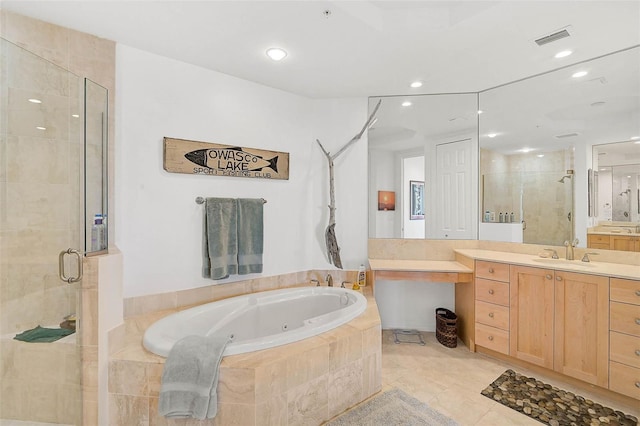 bathroom with visible vents, a tub with jets, vanity, a shower stall, and recessed lighting