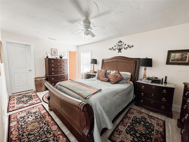 bedroom with visible vents and a ceiling fan