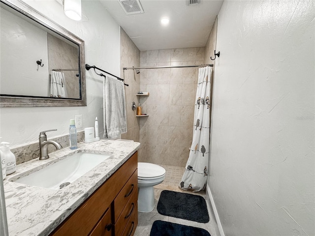 full bath featuring toilet, a shower stall, visible vents, and vanity