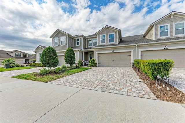 11607 Meadowgate Pl, Bradenton, FL 34211 - view of front of home featuring decorative driveway and a garage