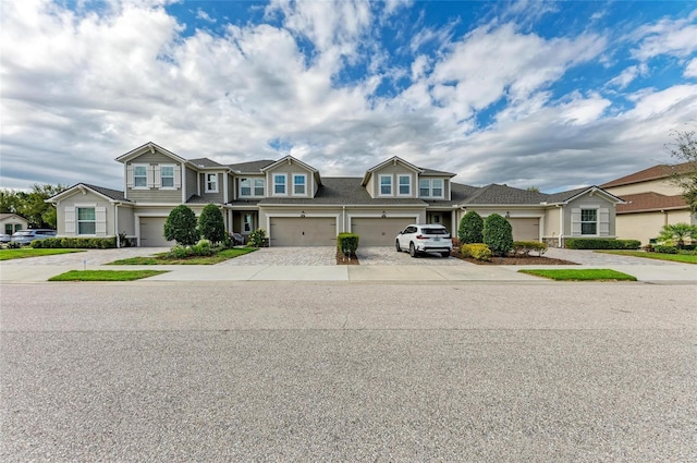 11607 Meadowgate Pl, Bradenton, FL 34211 - townhome / multi-family property featuring a garage and driveway