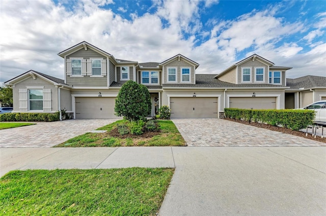 11607 Meadowgate Pl, Bradenton, FL 34211 - view of front facade featuring decorative driveway and a garage