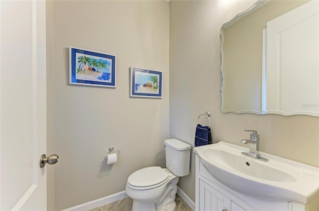 11607 Meadowgate Pl, Bradenton, FL 34211 - bathroom featuring toilet, vanity, and baseboards