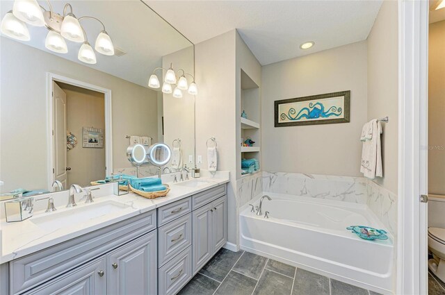 11607 Meadowgate Pl, Bradenton, FL 34211 - full bath with a bath, double vanity, toilet, and a sink