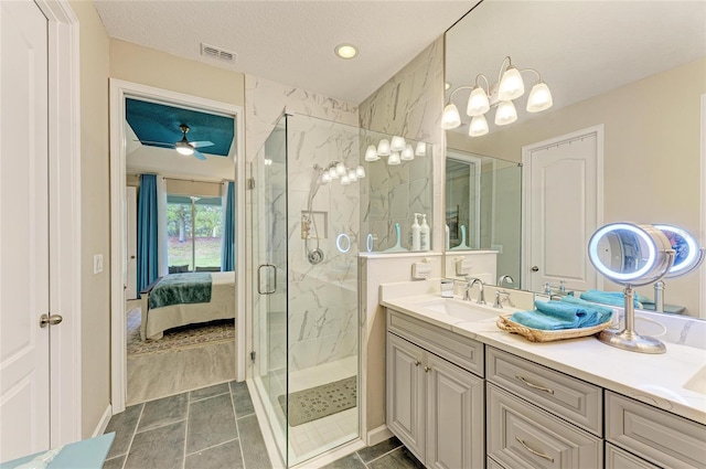 11607 Meadowgate Pl, Bradenton, FL 34211 - ensuite bathroom featuring a marble finish shower, visible vents, vanity, and a ceiling fan