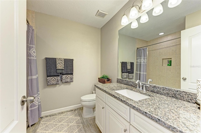 11607 Meadowgate Pl, Bradenton, FL 34211 - full bath with visible vents, baseboards, toilet, vanity, and a textured ceiling
