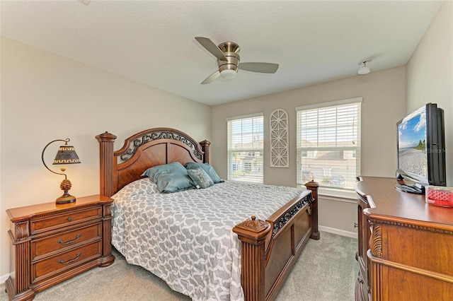 11607 Meadowgate Pl, Bradenton, FL 34211 - bedroom with baseboards, light carpet, and a ceiling fan