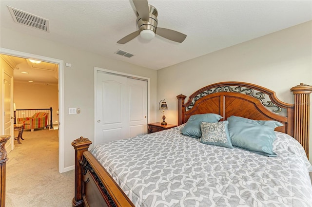 11607 Meadowgate Pl, Bradenton, FL 34211 - bedroom with visible vents, light colored carpet, a closet, and a ceiling fan